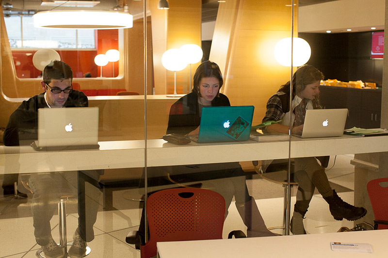 Photo of students studying by themselves with laptops