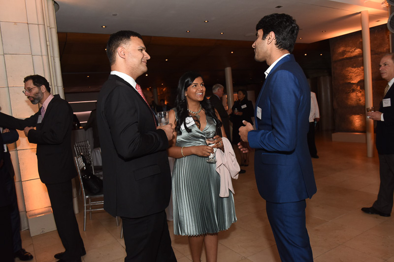 Photo of guests talking at the reception