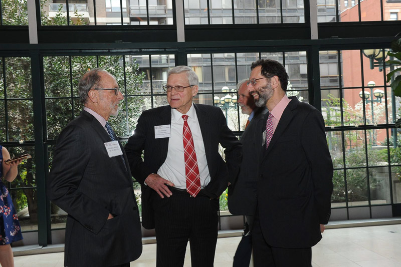 Photo of Dean Joe Thomas talking with guests