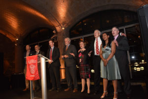 Photo of award recipients singing alma mater