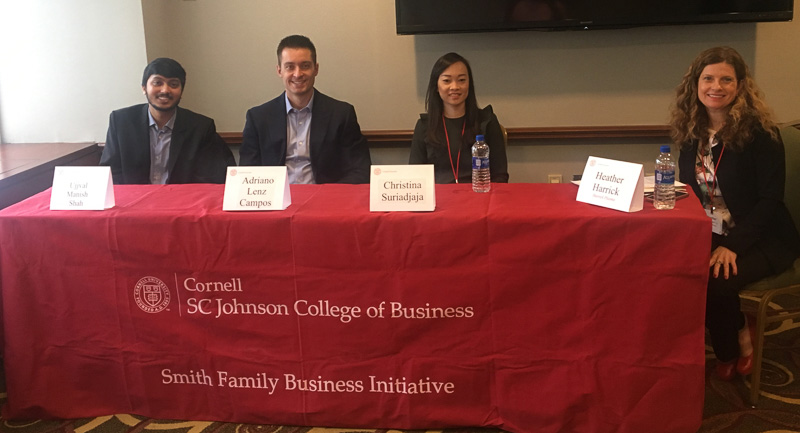 Photo of the panelists sitting at a table