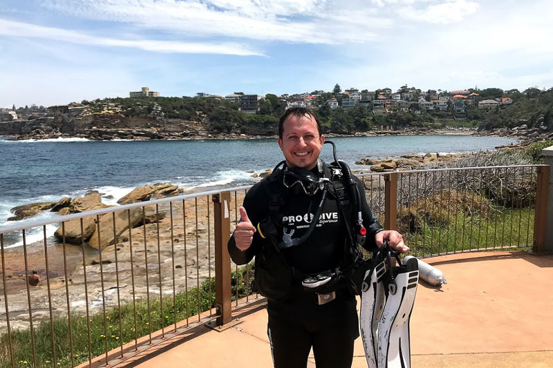 Photo of Tony giving a thumbs up in SCUBA gear