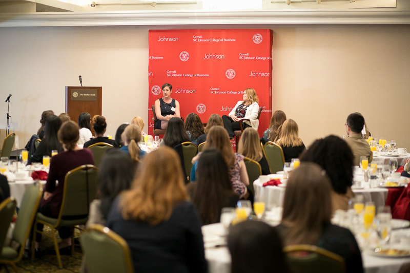 Photo of Sarah Brubacher McDonald and Risa Mish speaking to attendees
