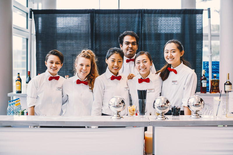 Photo of 6 HEC waitstaff in their service uniforms