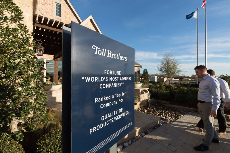 Photo of people entering a building that says Toll Brothers, Fortune 'World's most admired companies"