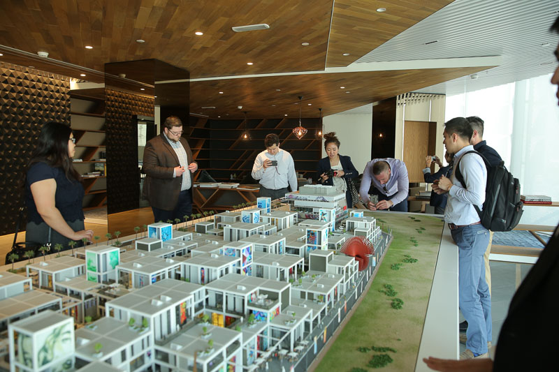 Photo of students looking at a large scale model of a city