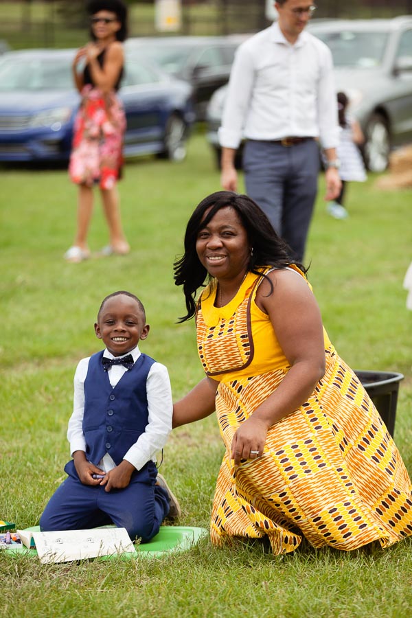 Photo of a women and her son sitting in the lawn