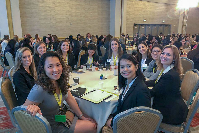 Photo of women sitting around a table