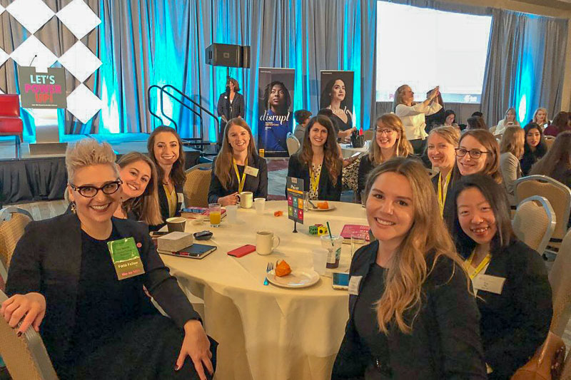 Photo of women sitting around a table