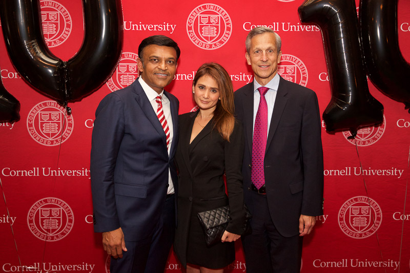 Photo of three people in front of the SHA step-and-repeat on the red carpet