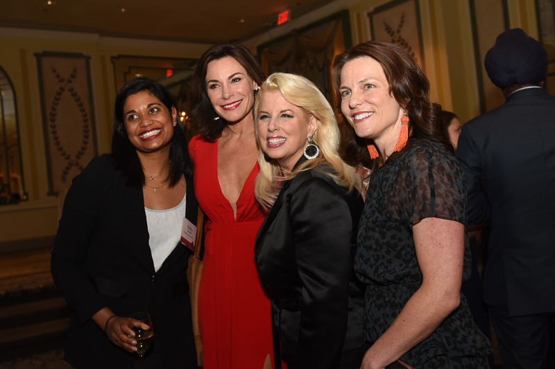 Photo of four people in the banquet hall