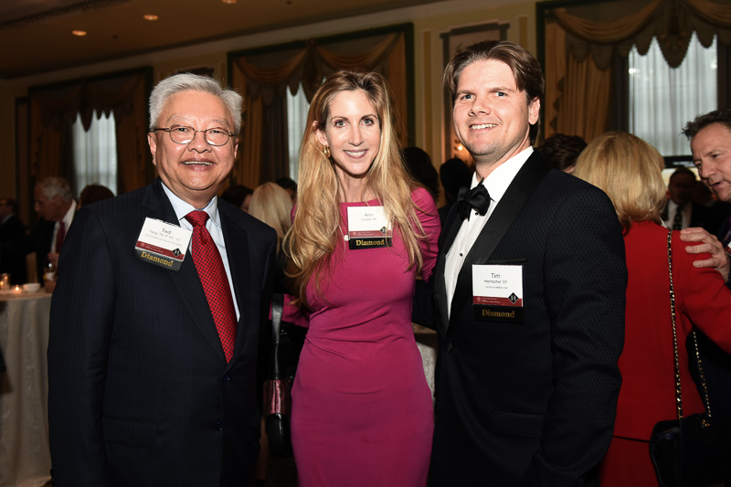 Photo of three people in the banquet hall