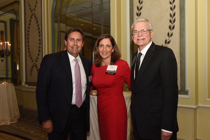 Photo of three people, including Joe Thomas, College of Business Interim Dean