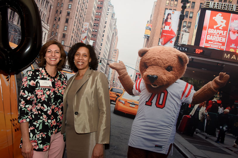 Photo of two women and touchdown the bear on a NYC street