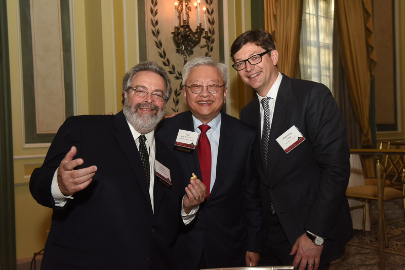 Photo of three men in the banquet hall