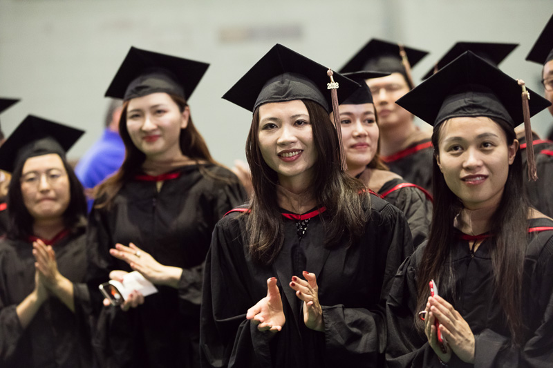 Photo of graduates clapping