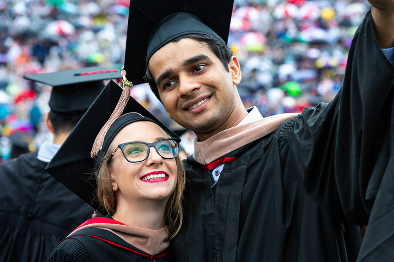 Photo of two grads taking a selfie