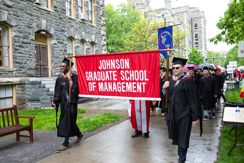 Photo of graduate banner bearers