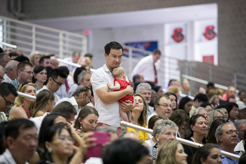 Photo of an audience member holding a baby