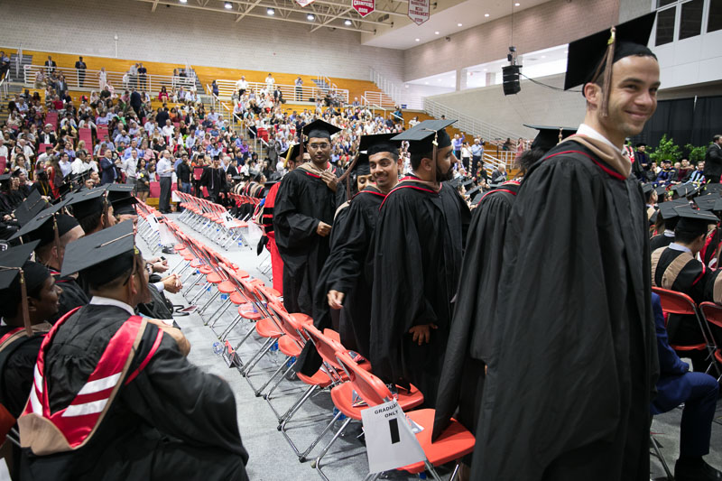 Photo of standing graduates