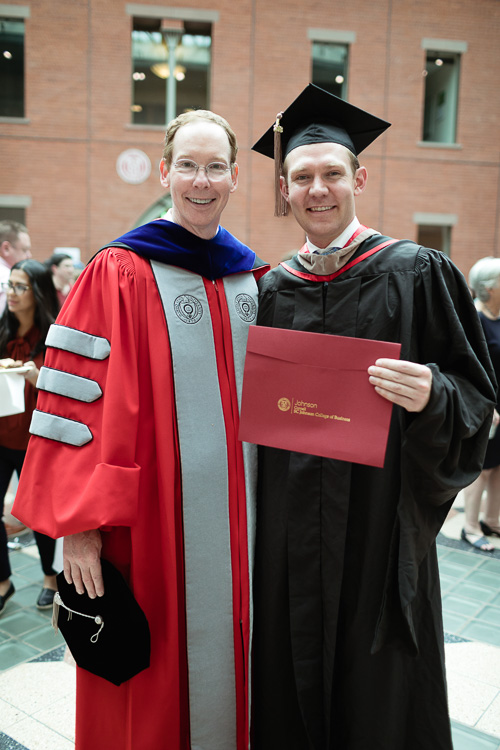 Photo of Dean Nelson and a graduate