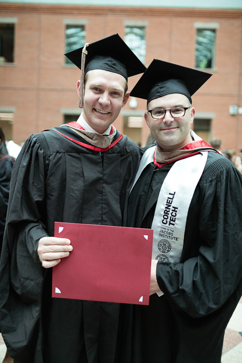 Photo of two graduates