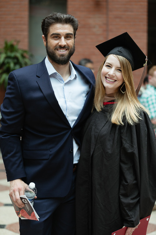 Photo of a graduate and a man