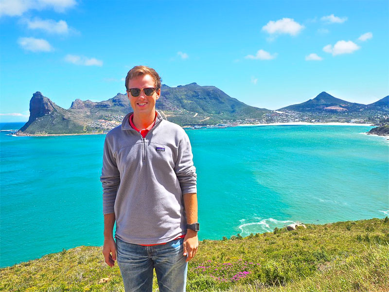 Photo of Robert with bright blue water in the background