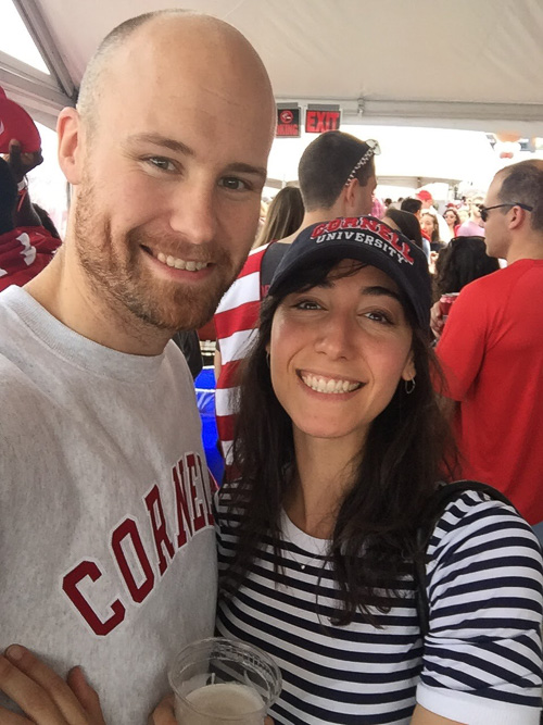 Photo of Sam and Emma under a homecoming tent