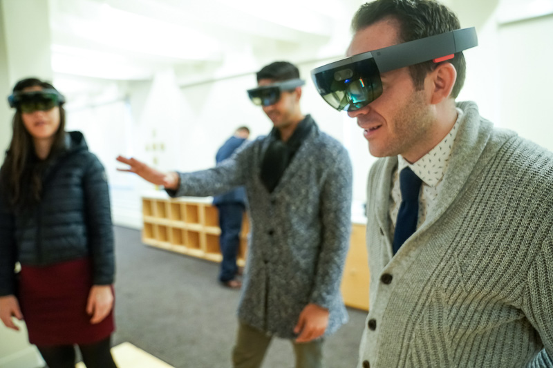 Photo of two men wearing virtual reality goggles