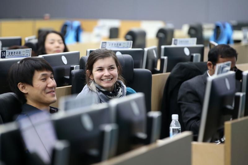 Photo of a woman smiling in a computer lab