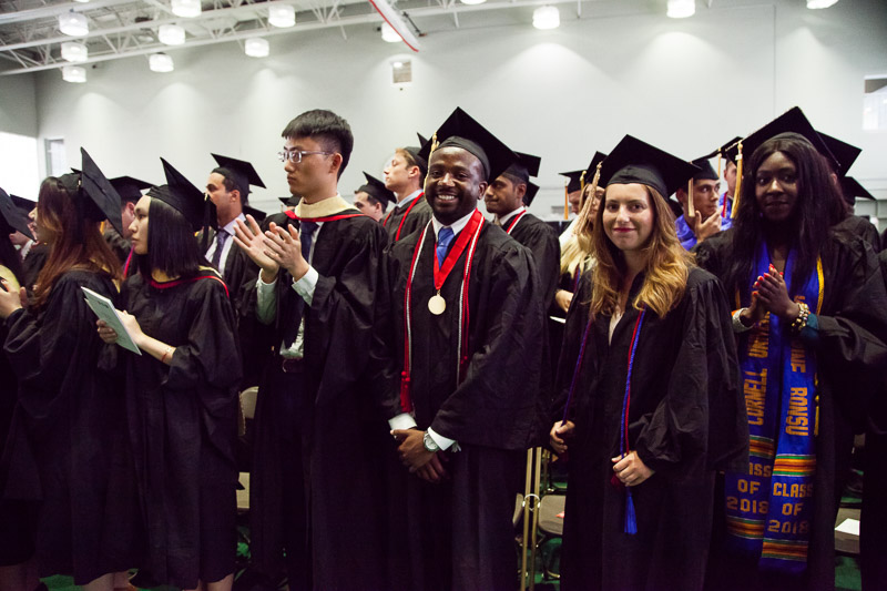 Photo of graduates standing up together