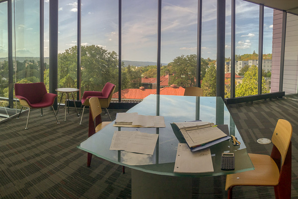 Photo of a study spot overlooking campus through glass windows