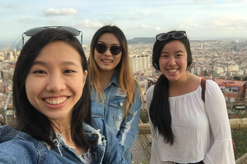 Photo of Tasha and two other women overlooking an historic city