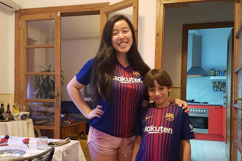 Photo of Tasha and her host brother wearing soccer jerseys