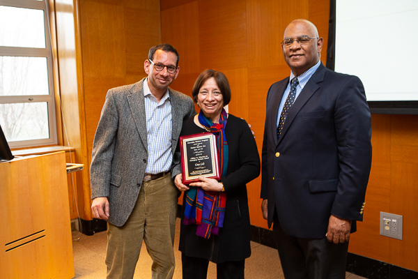 Photo of Lele with her son, Abhijeet, MBA ’89, and Ralph Christy, professor and director of Cornell’s International Institute for Food, Agriculture, and Development.