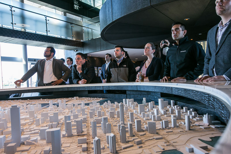 Photo of students looking at a scale model of a city