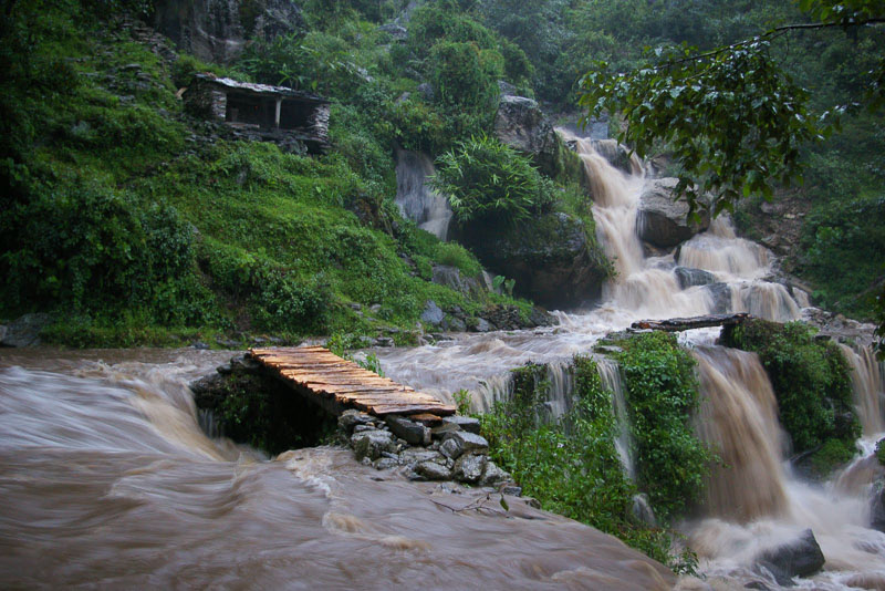 Photo of a river rushing over hills