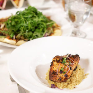 Photo of two dishes, appears to be fish and flatbread