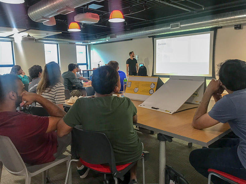 Photo of students listening to a presentation