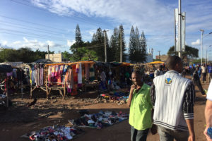 Photo of the streets of Kenya, lots of hanging clothes