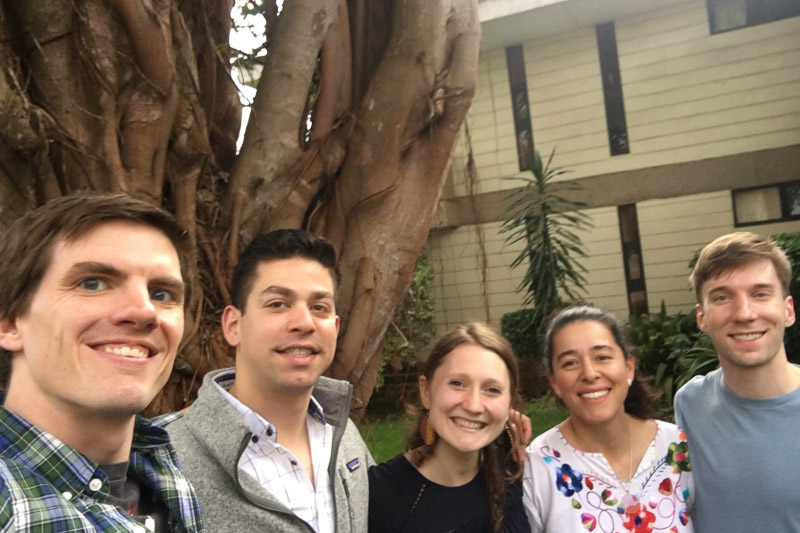 Photo of a group of five people taking a selfie