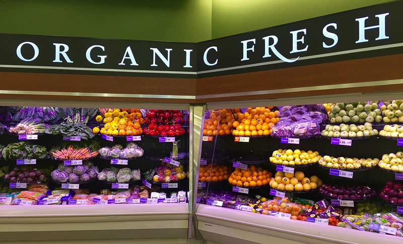 Photo of a grocery store produce section labeled "organic fresh"