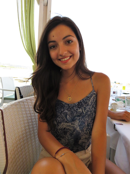 Photo of Tatiana sitting in a restaurant chair