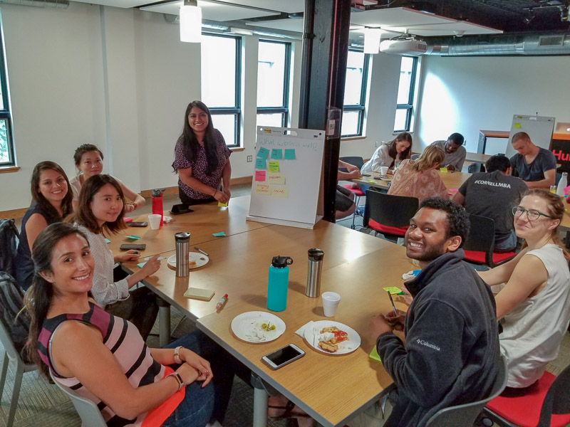 Photos of a student working on a whiteboard and other sitting around a table