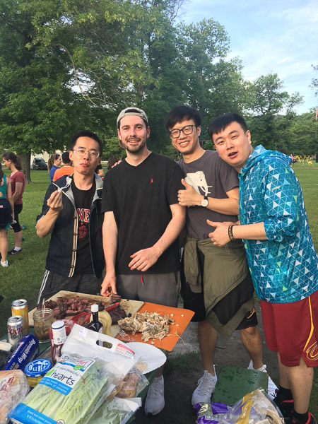 Students having barbecue at the park.