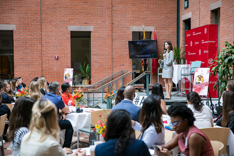 Photo of Angela speaking to a room full of JWiB visitors