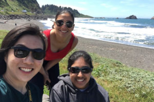 Photo of three women at a beach