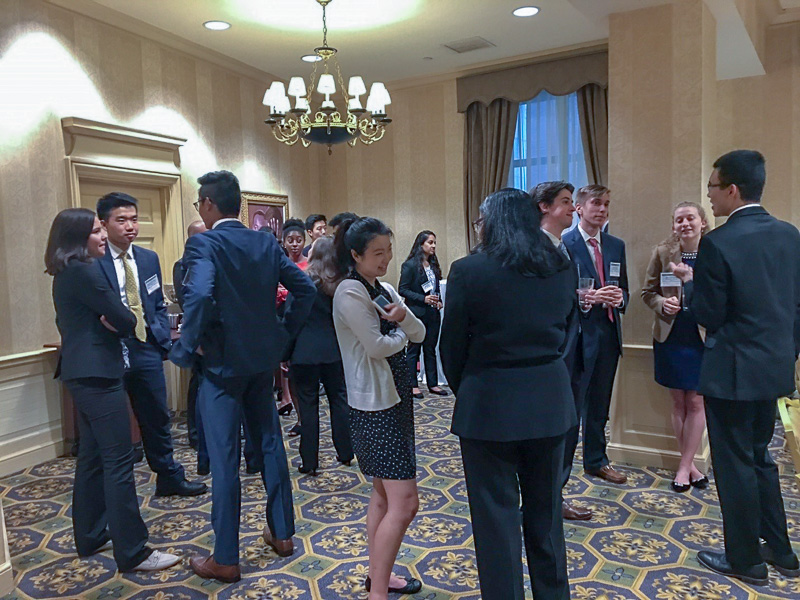 Photo of people mingling in a ballroom