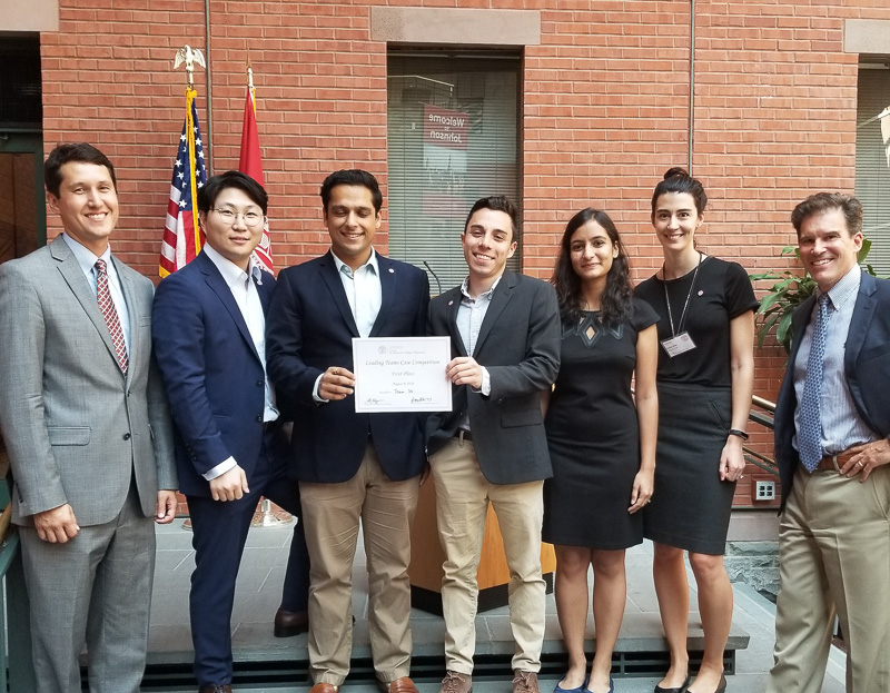 Photo of students holding a certificate 